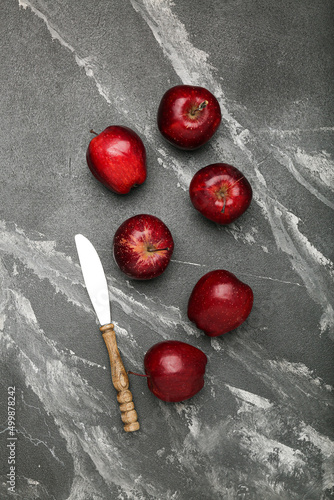 Fresh red apples. On a black stone background. Top view.