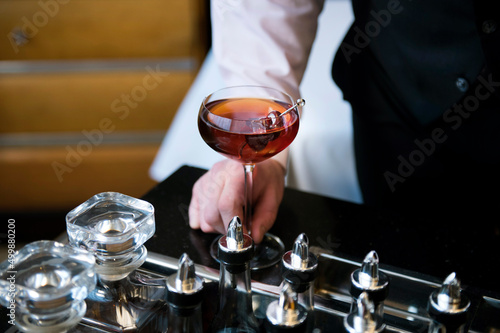 Manhattan cocktail being served