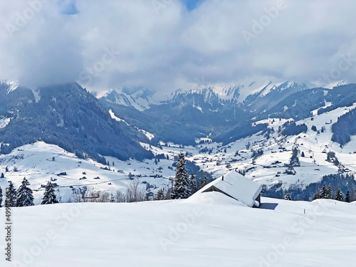 Beautiful winter ambience in the alpine valley of the Lutheren stream, at the foot of the Alpstein mountain range and in the Obertoggenburg region - Nesslau, Switzerland (Schweiz) photo