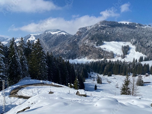 Beautiful winter ambience in the alpine valley of the Lutheren stream, at the foot of the Alpstein mountain range and in the Obertoggenburg region - Nesslau, Switzerland (Schweiz) photo