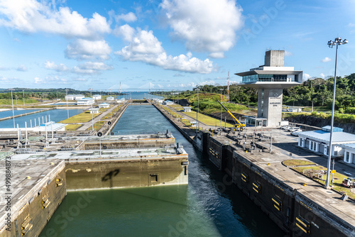 Panama Canal: Agua Clara Locks, set of three new locks with Atlantic Bridge. Agua Clara control tower (torre de control). Rolling gate half opened half closed.  photo