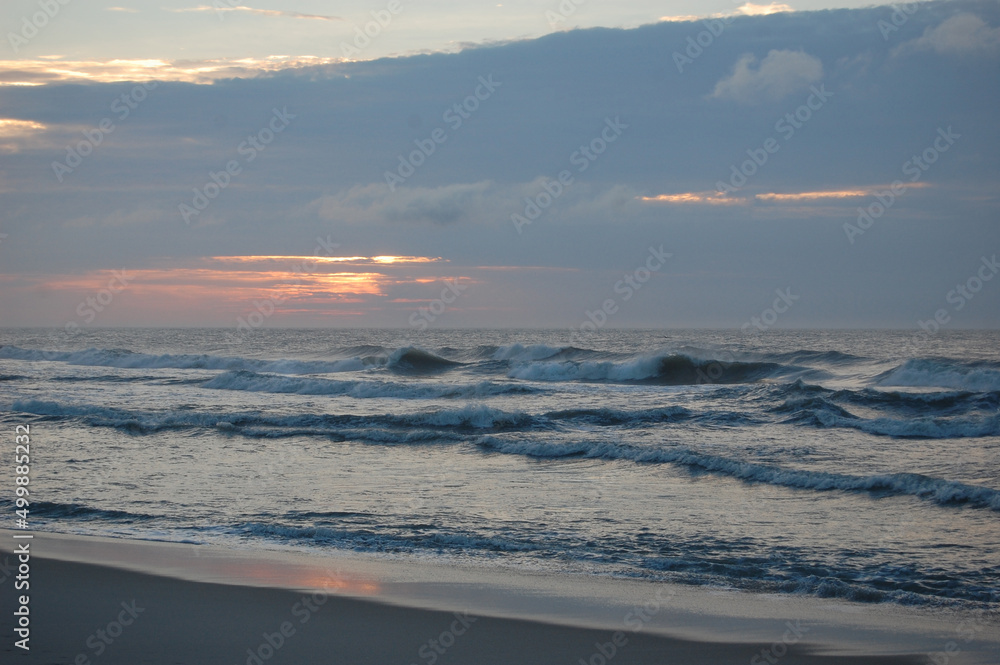 The natural colors of a beautiful sunrise over the Atlantic Ocean, off the Coast of Assateague Island, Maryland.
