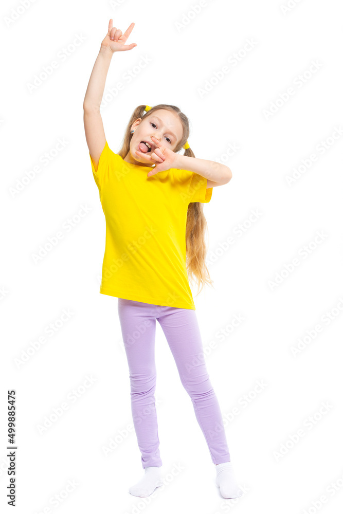 A happy and cheerful child dressed in a yellow T-shirt and purple pants plays, jumps. A happy and cheerful child dressed in a yellow T-shirt and purple pants plays, jumps.