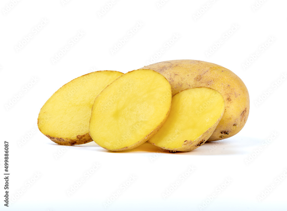 Sliced raw potatoes and a whole potato on a white background.