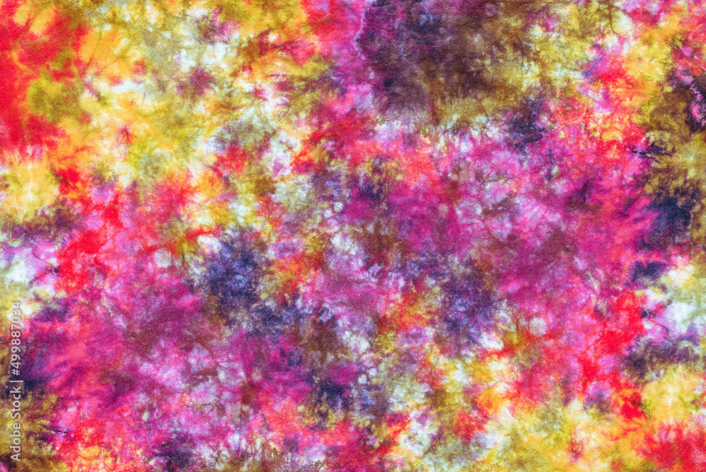 tie dye pattern hand dyed on cotton fabric background.
