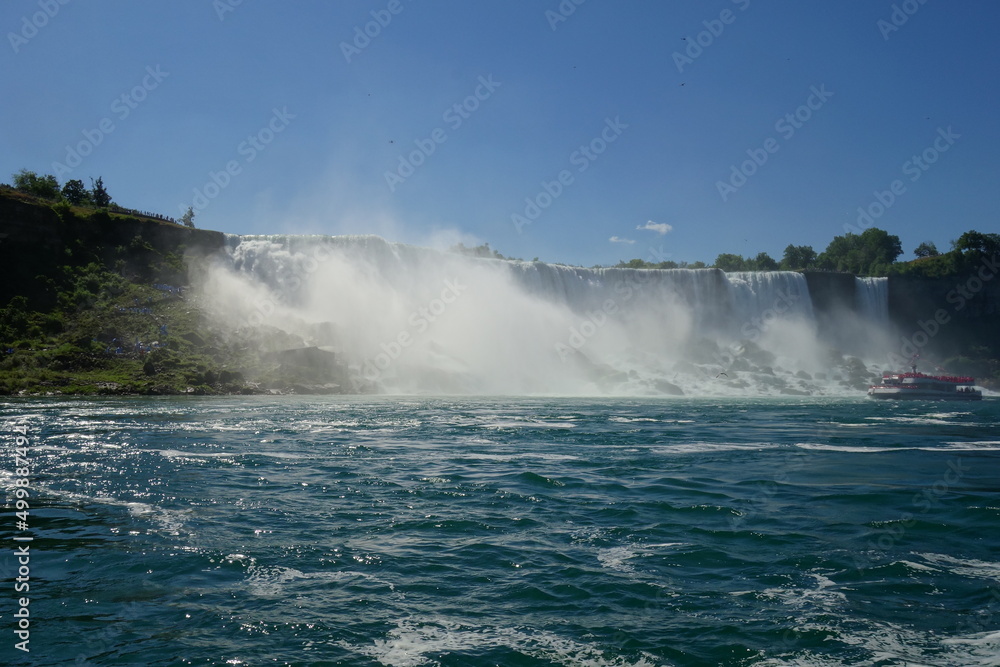Niagara Falls from Canada side during the summer with ships. 