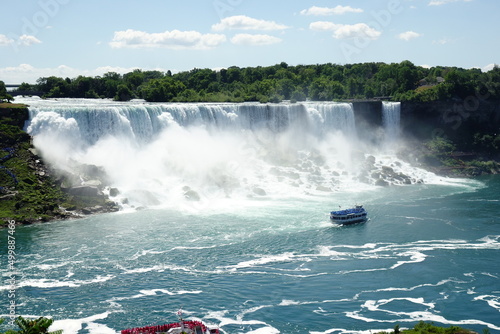 Niagara Falls from Canada side during the summer with ships. 