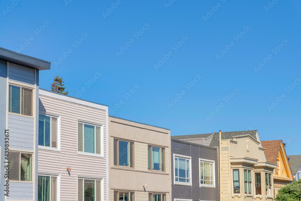 Neighborhood in San Francisco, California with box roofs exterior against the clear blue sky.