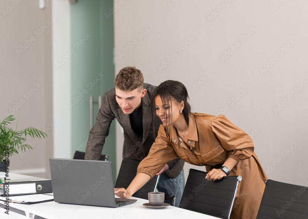 Group of young business people working in the office Group of young business people working in the office