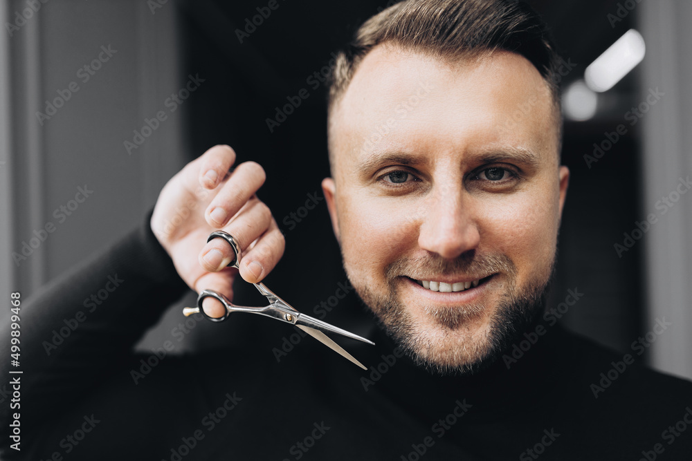 Mans haircut in barber shop. Barber scissors, barber shop. Barber