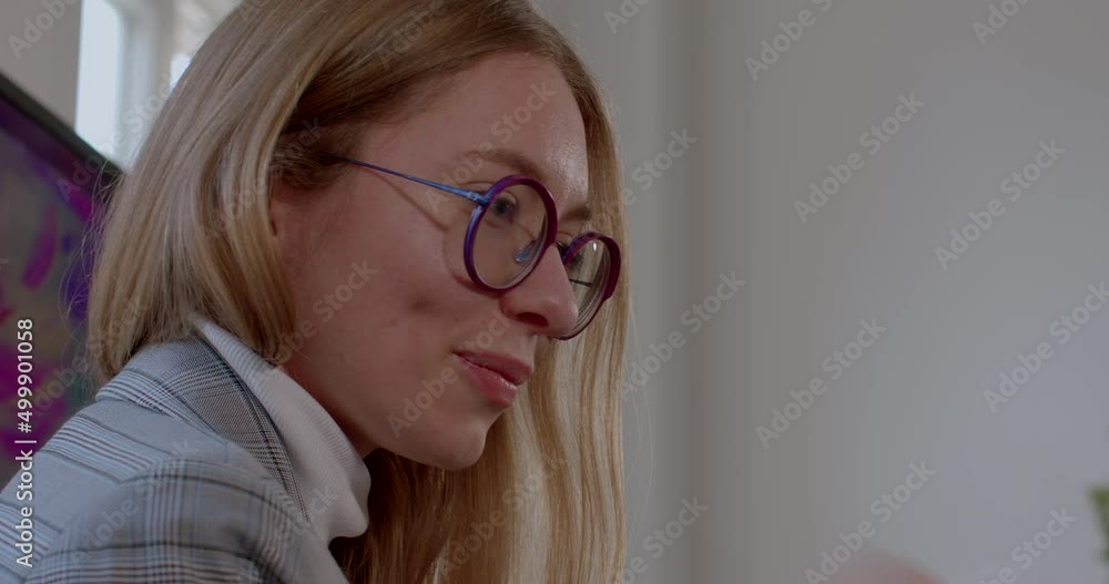 Portrait of a young female teacher with a digital pen. Communication with students during the art lesson. White stylus in hand. Portrait of a young female teacher with a digital pen. Communication with students during the art lesson. White stylus in hand.