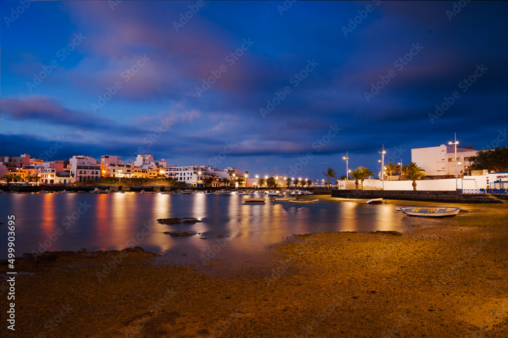 Reflections of light at sunset in the bay of Arrecife (Lanzarote, Spain) Reflections of light at sunset in the bay of Arrecife (Lanzarote, Spain)