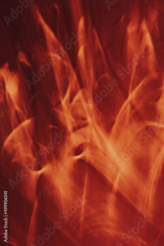 Bright red flames on black, abstract background. Vertical banner.