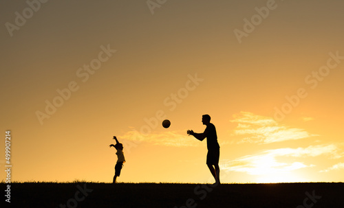 Happy father son relationship. silhouette of dad and child playing together in the park at sunset