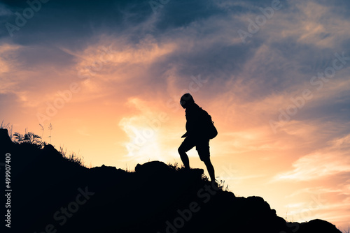 Man hiking up a mountain 