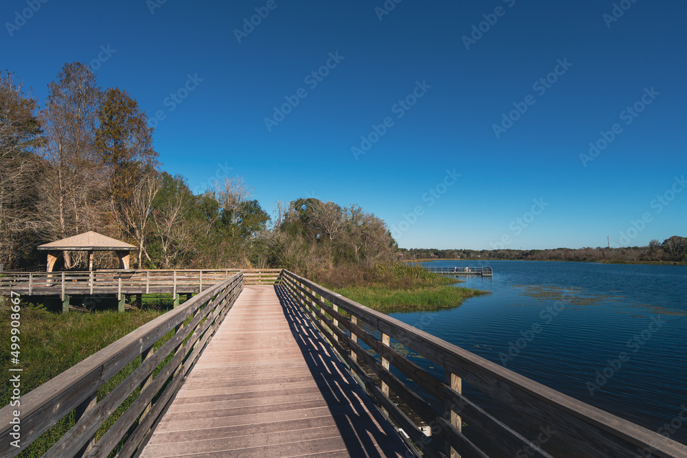Boardwalk on water at Lake Lotus nature park in Altamonte Springs, a suburb of greater Orlando area in Florida Boardwalk on water at Lake Lotus nature park in Altamonte Springs, a suburb of greater Orlando area in Florida