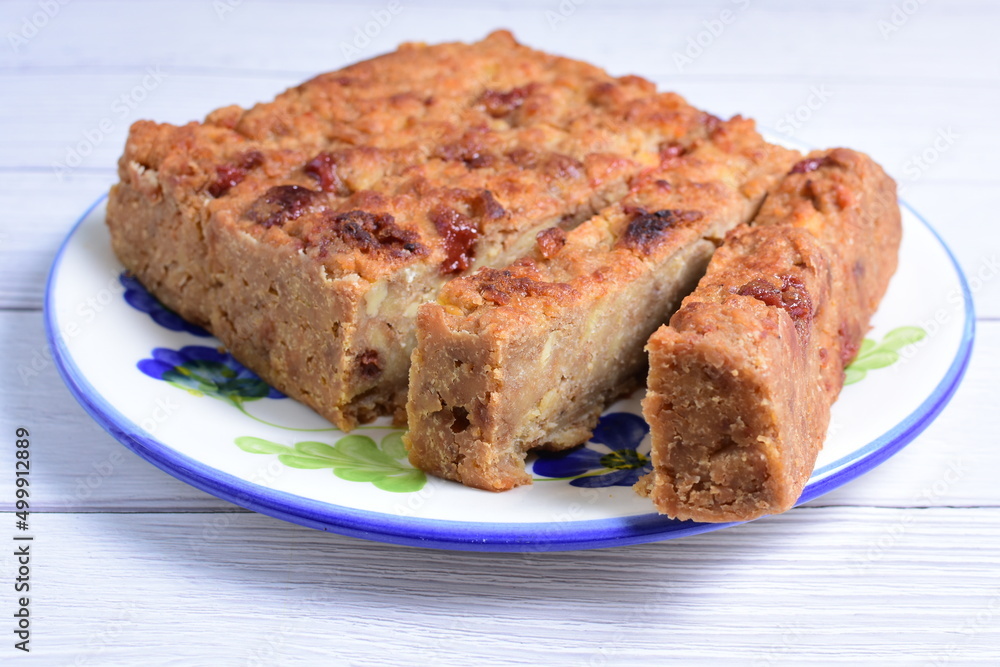 Fluffy bread cake with guava flavor on wooden background