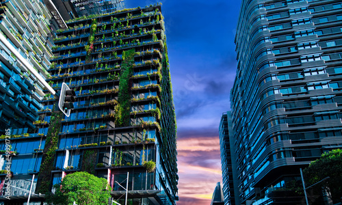 Apartment block in Sydney NSW Australia with hanging gardens and plants on exterior of the building at Sunset with lovely colourful clouds in the sky photo