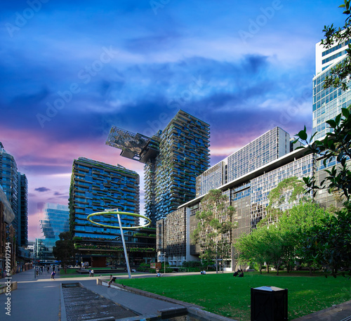 Apartment block in Sydney NSW Australia with hanging gardens and plants on exterior of the building at Sunset with lovely colourful clouds in the sky photo