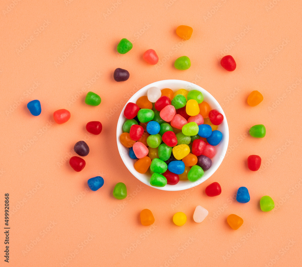 Small colored candies in the ceramic bowl