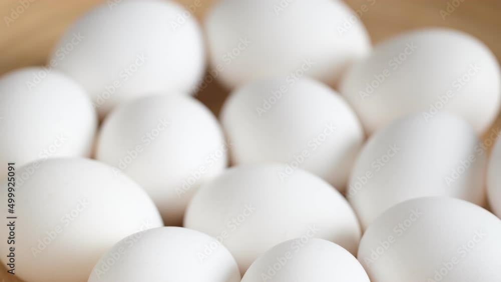 Chicken egg, rotation shot, Chicken fresh raw eggs.Healthy fresh food ingredients for breakfast. Animal products. Grocery. Chicken farm fresh eggs Chicken egg, rotation shot, Chicken fresh raw eggs.Healthy fresh food ingredients for breakfast. Animal products. Grocery. Chicken farm fresh eggs