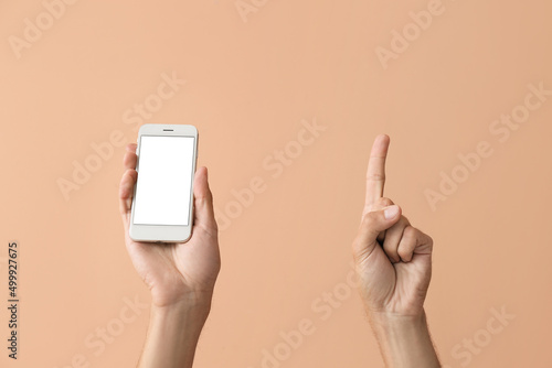 Male hands with modern mobi...