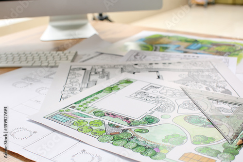 Landscape designer's projects on table in office