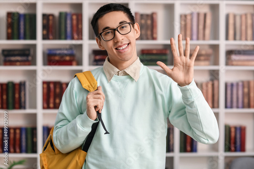 Male Asian student with bac...