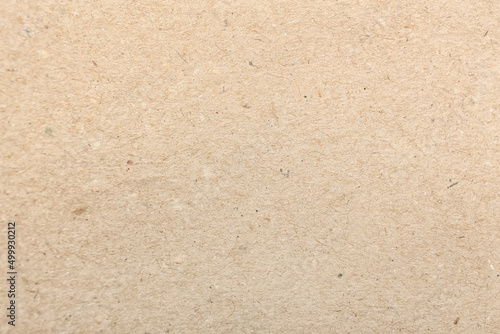 Texture of beige paper as background, closeup