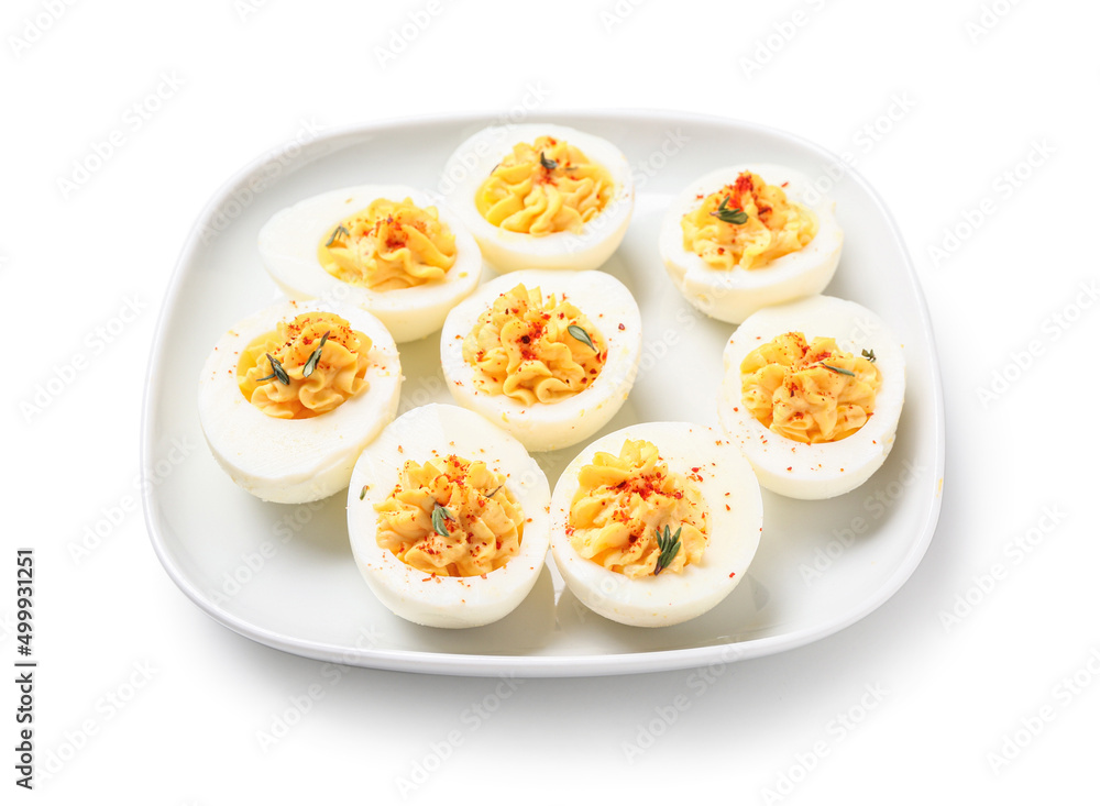 Plate with tasty stuffed eggs on white background. Easter celebration Plate with tasty stuffed eggs on white background. Easter celebration