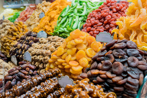 Close up of display with traditional turkish delights  dried fruits and nuts at Egyptian Bazaar. Best delicious turkish foods to try on trip to Istanbul. Selective focus