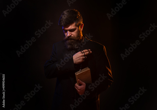 Obraz na plátně Praying hands priest portrait of male pastor