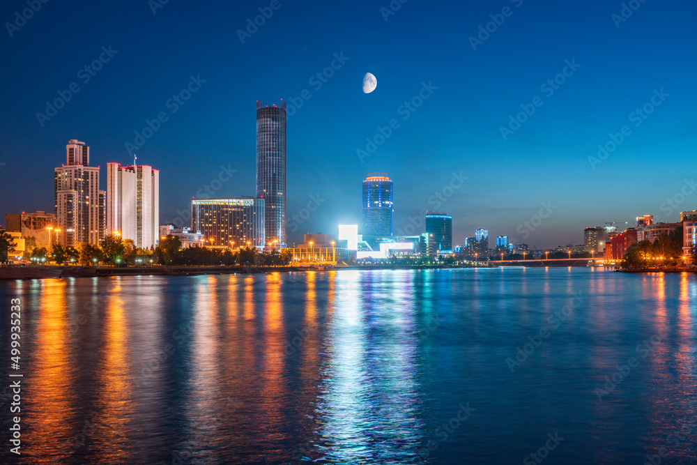 Fototapeta premium Night with big moon on a pond in the center of the city. Yekaterinburg city and pond at night.