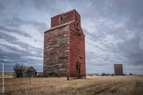 Moody skies over two old grain elevators in Neidpath, Saskatchewan, Canada
