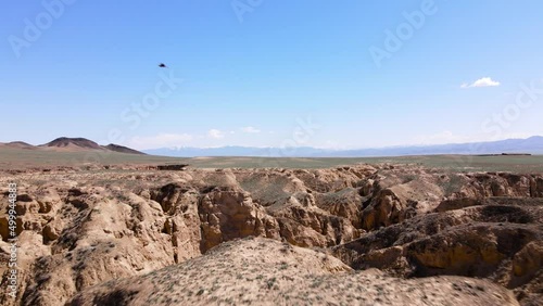 Drone shot of Eagle fly in canyon desert mountains