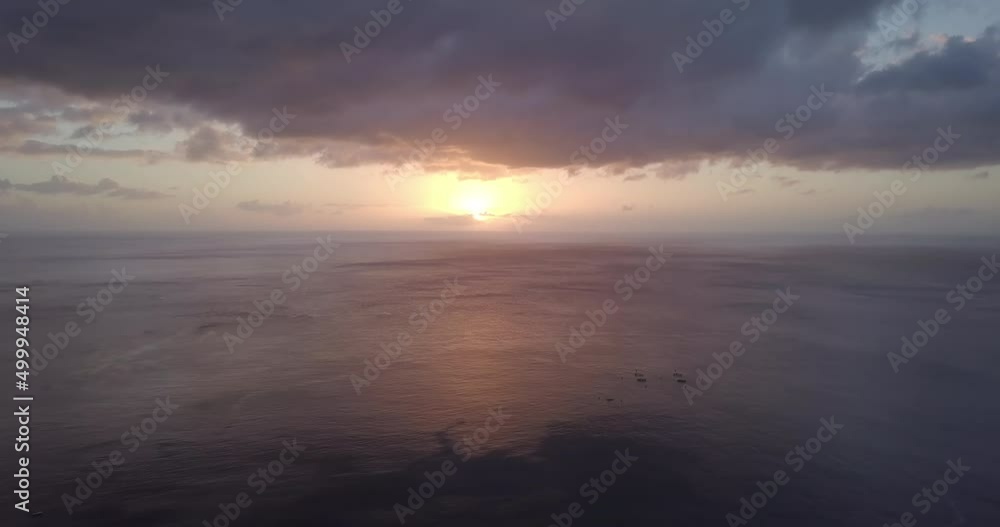 Aerial view of a sunset in the horizon. Flying over the Caribbean sea. Aerial view of a sunset in the horizon. Flying over the Caribbean sea.