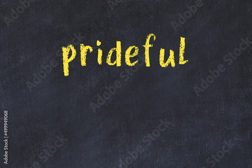 Obraz na plátně College chalk desk with the word prideful written on in
