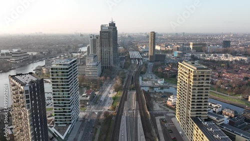 Amsterdamn Amstel urban city aerial drone view transportation and urban residential construction towers. Infrastructure train station business buildings and skyline. Water canal. photo