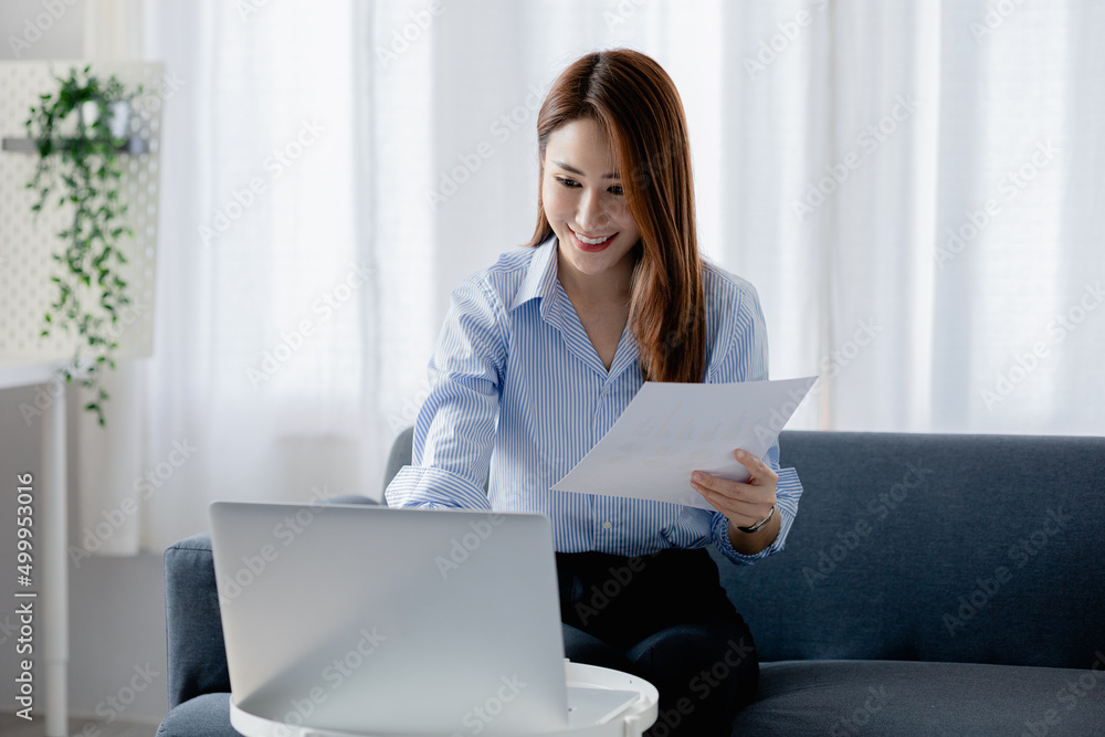 Business woman in the living room, she working from home due to the COVID-19 situation, she presenting to managers, online meeting via remote conferencing program. Work from home concept. Business woman in the living room, she working from home due to the COVID-19 situation, she presenting to managers, online meeting via remote conferencing program. Work from home concept.