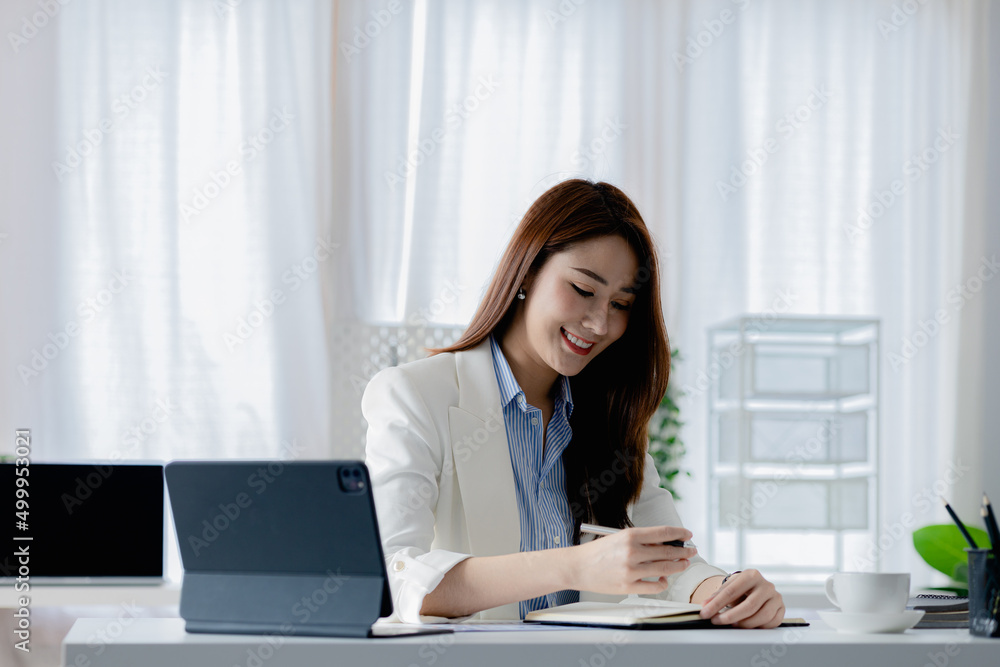Asian women working in the office, young Asian business women as business executives, founding and running start-up executives, young female business leaders. Startup business concept. Asian women working in the office, young Asian business women as business executives, founding and running start-up executives, young female business leaders. Startup business concept.