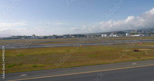 Flying above the runway on Honolulu International Airport (Daniel K. Inouye International Airport). View from helicopter. Oahu island, Hawaii photo