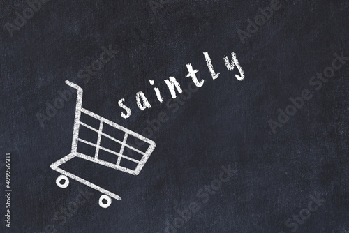Tablou pe pânză Chalk drawing of shopping cart and word saintly on black chalboard