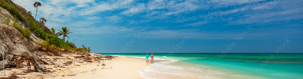 Panoramic paradise island resort with seniors on shoreline