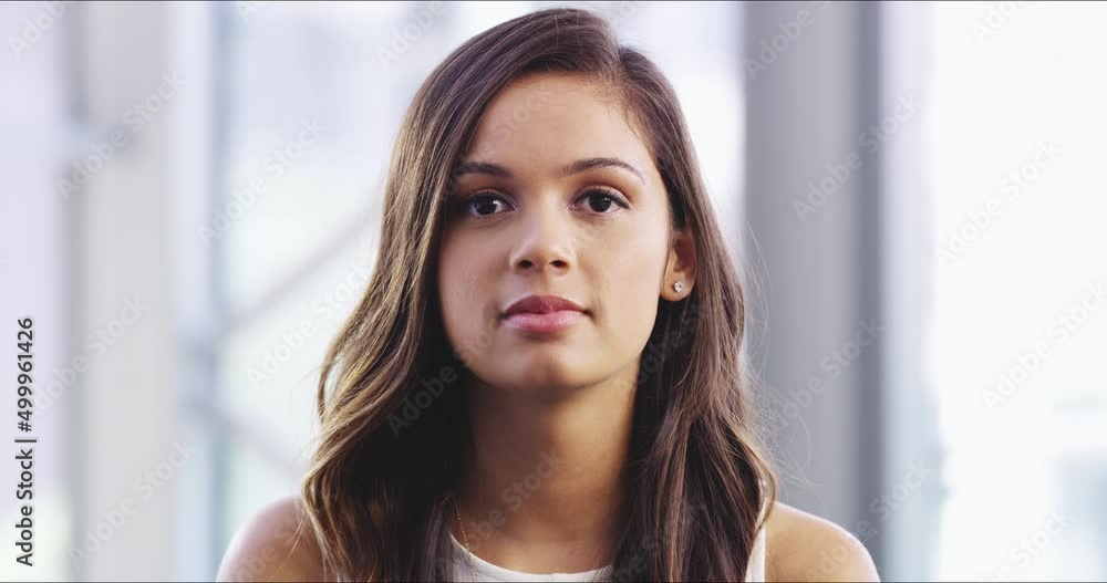 Keeping a straight face. Attractive young businesswoman in her corporate office. Beautiful professional business woman looking confident at work in her office Keeping a straight face. Attractive young businesswoman in her corporate office. Beautiful professional business woman looking confident at work in her office