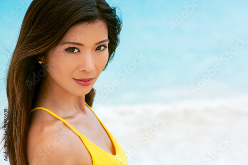 Portrait of attractive Asian woman on beach vacation