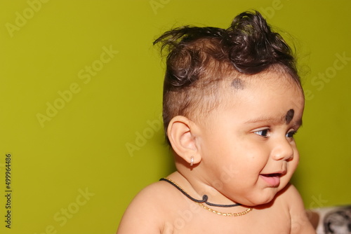 Photography portrait photo of A lovely cute little Indian hindu baby boy without clothes wit