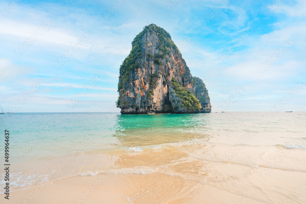 sea, beach and rocky mountains in tropical evening sea, beach and rocky mountains in tropical evening
