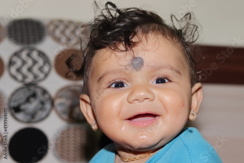 Photography portrait photo of A lovely cute little Indian hindu baby boy looking at the came