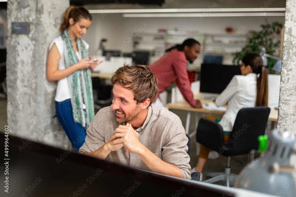 Group of happy multiethnic business people working together, sharing ideas in corporate office. Group of happy multiethnic business people working together, sharing ideas in corporate office.