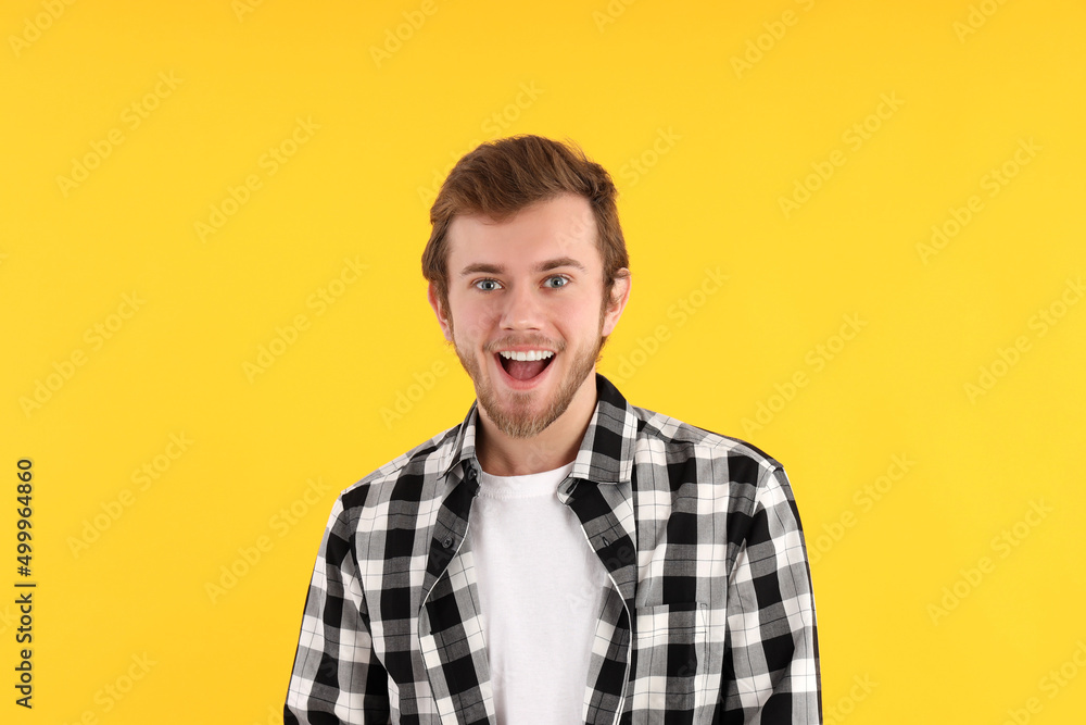 Concept of people with young man on yellow background Concept of people with young man on yellow background